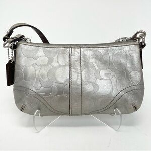Coach Silver Clutch Wristlet with Signature Embossed Design